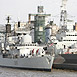 HMS Exeter berths alongside HMS Belfast London